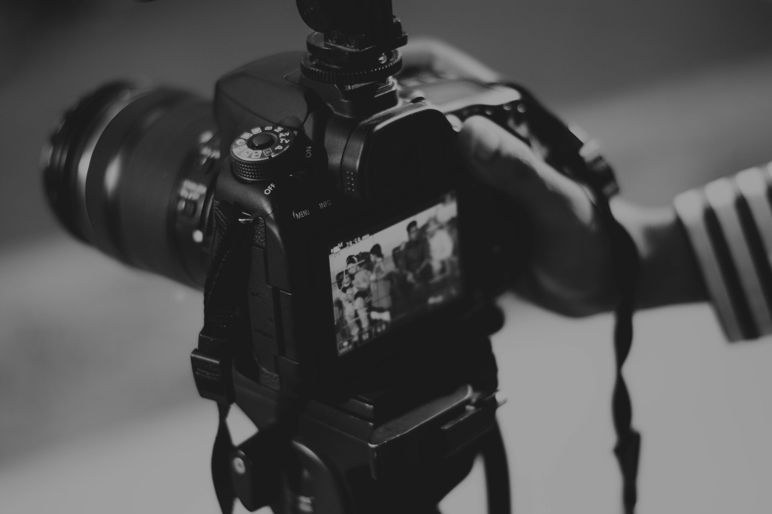 On Site Filming Close up of professional camera filming a group of people