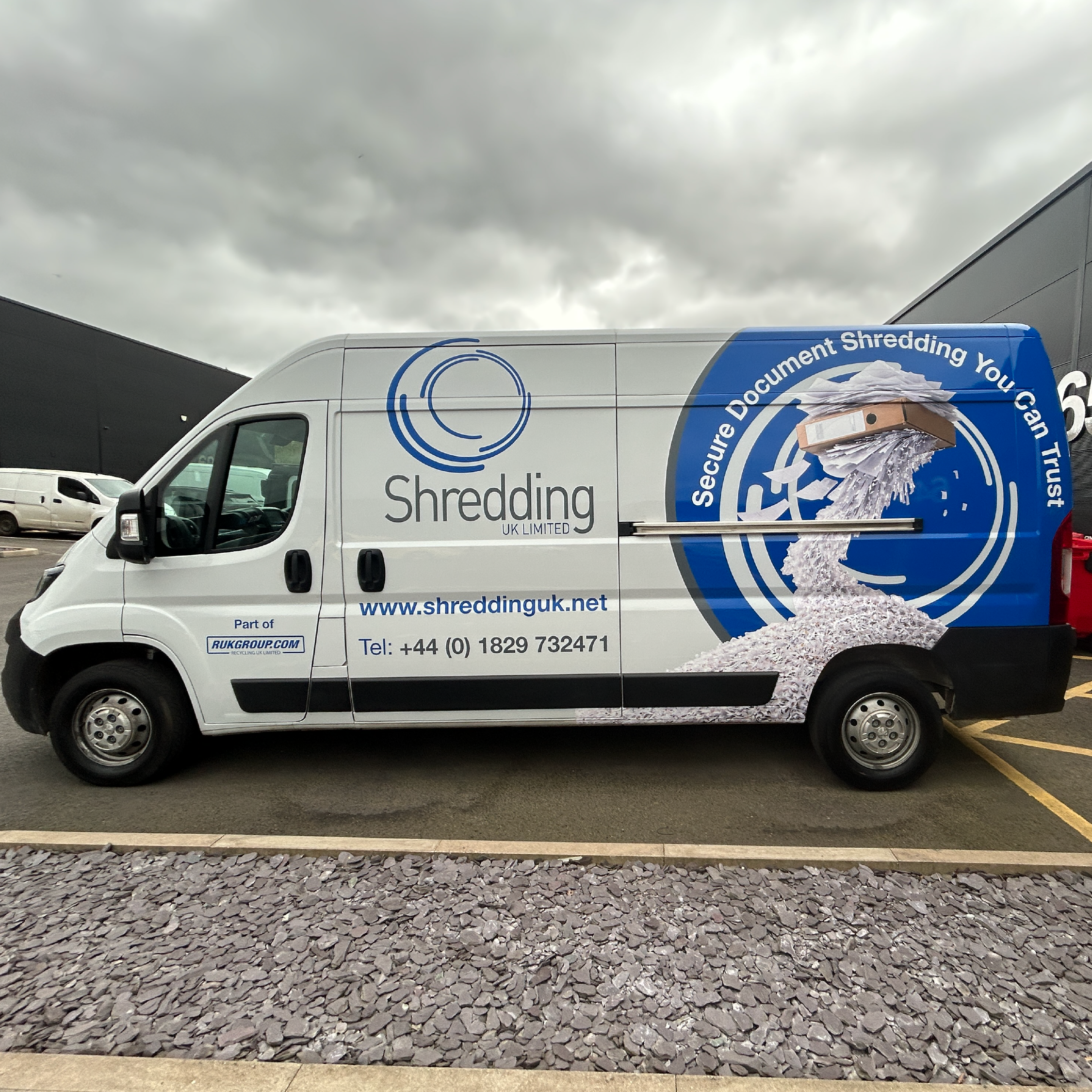Blue bespoke van vehicle graphics with logo
