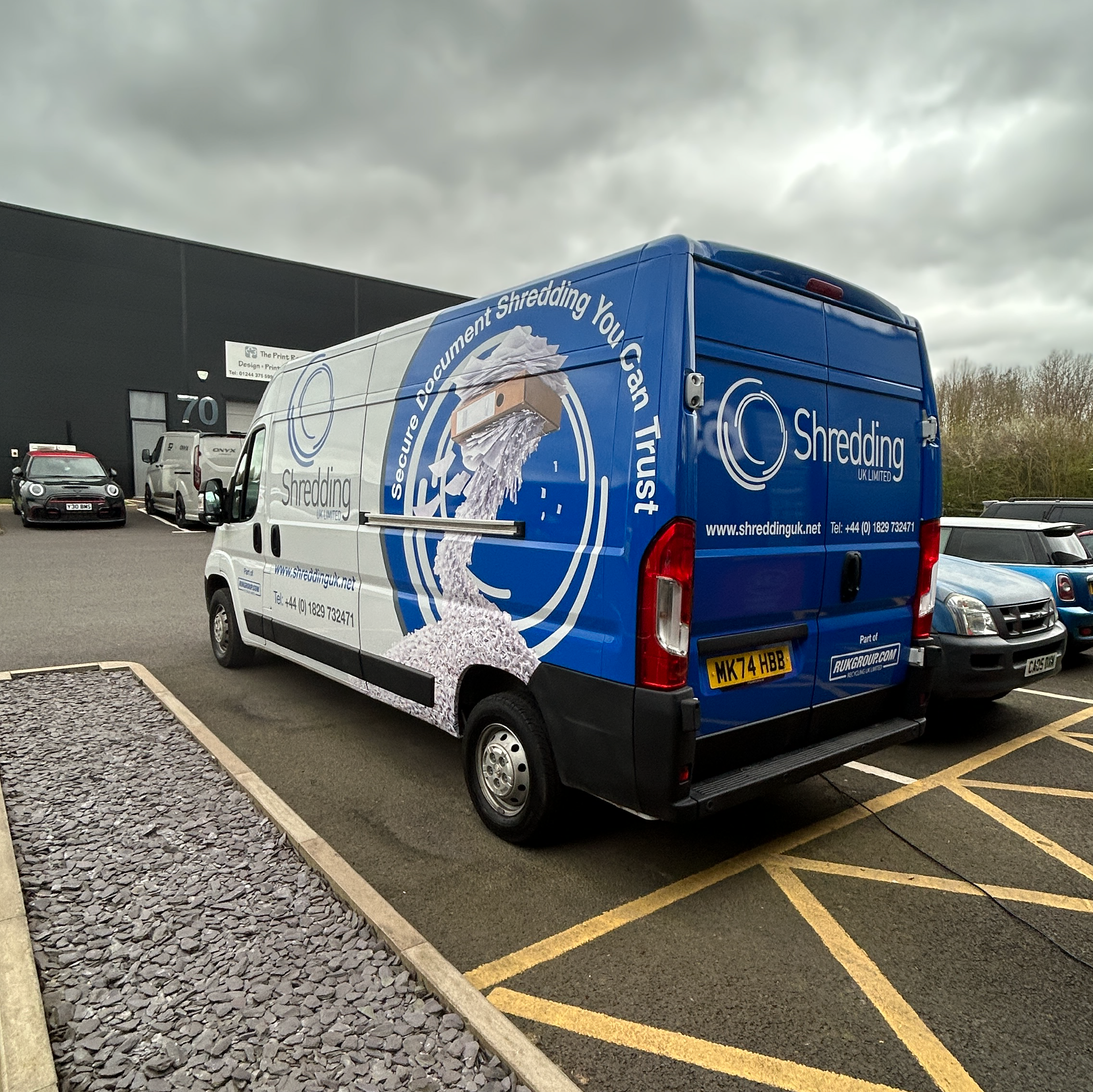 Blue bespoke van vehicle graphics with logo
