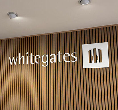 signage-whitegates-raised-lettering Internal business signage inside store