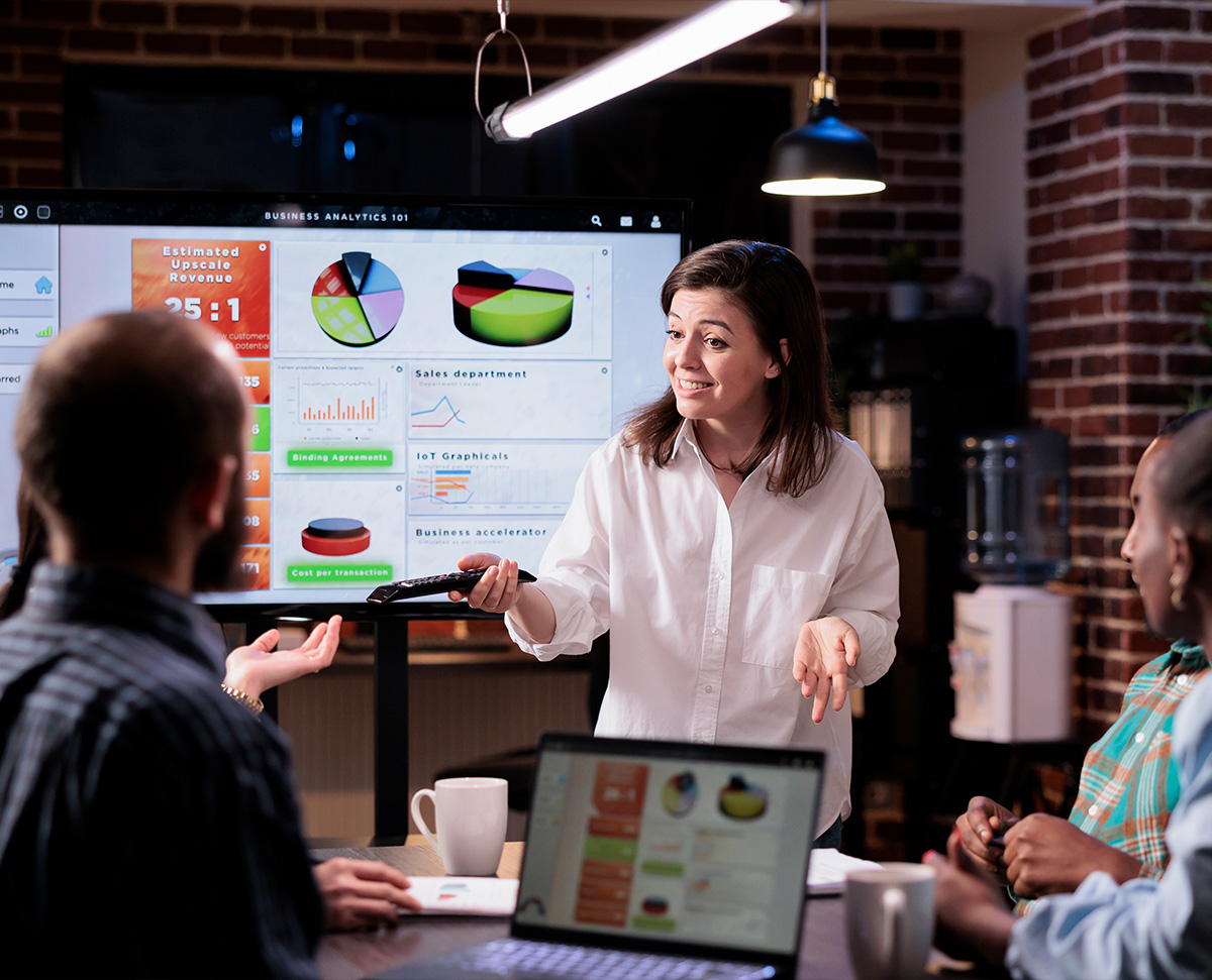 1:3 Team presenting business analytics dashboard in meeting – Macclesfield digital marketing reporting and insights