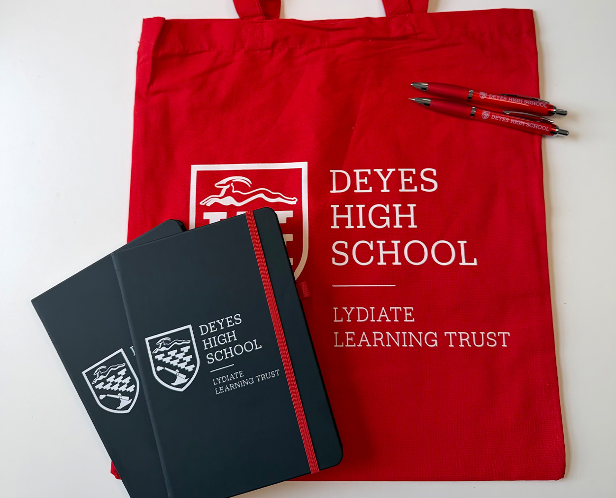 Deyes High School Branded Merchandise – Lydiate Learning Trust Deyes High School branded tote bag, notebooks and pens in red and black