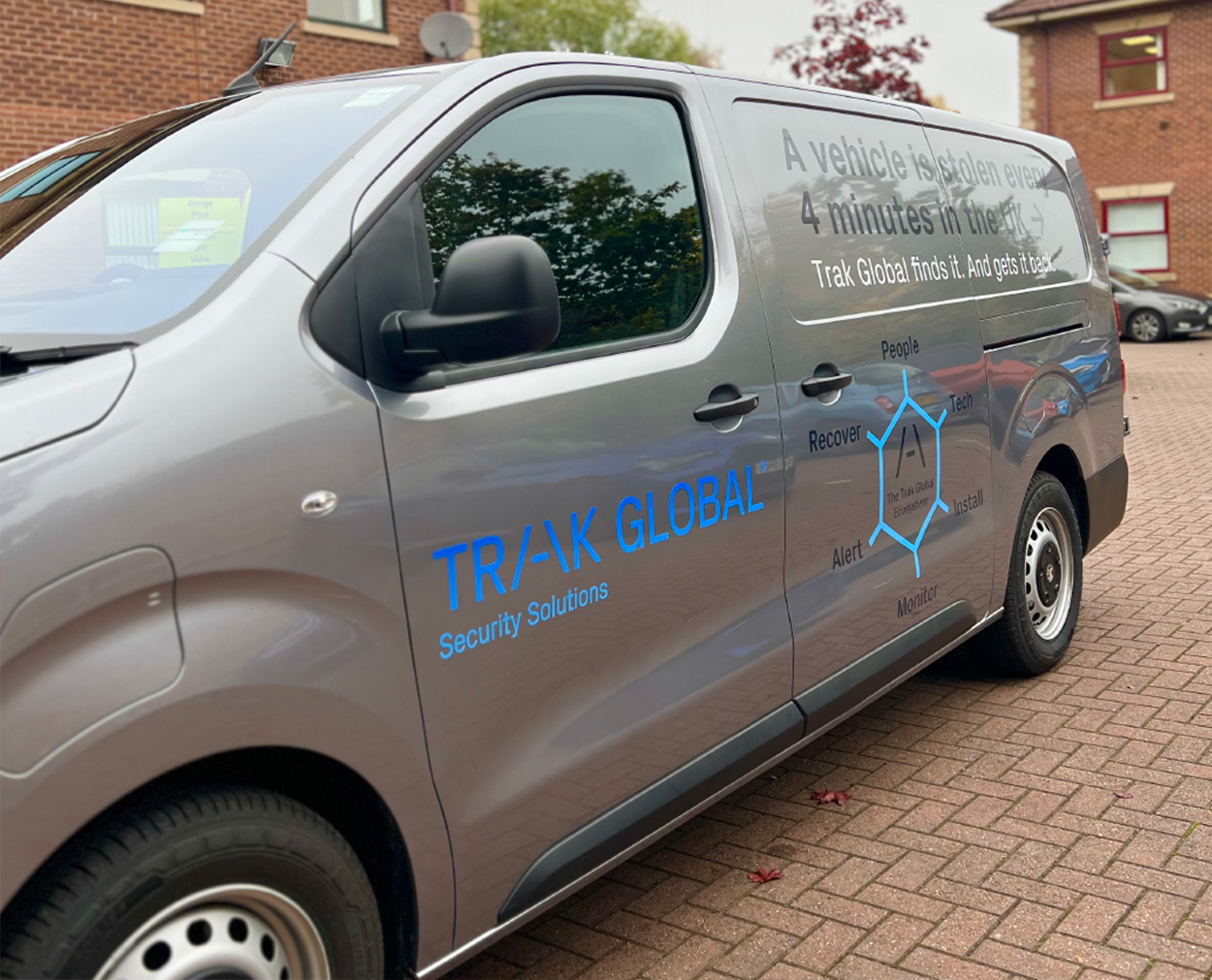 TRAK Van Vehicle graphics design printed and applied to Trak Global Security Solutions van