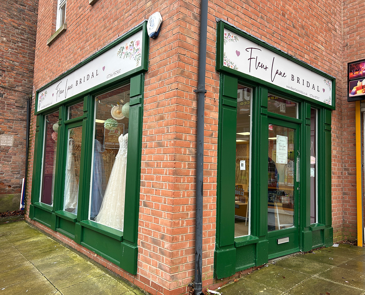 Bridal Shop Signage and Branding Fleur Lane Bridal shopfront signage with green fascia and floral branding in Whitchurch