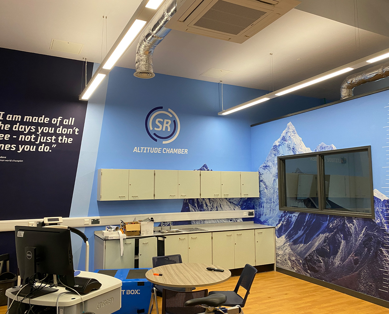 Altitude Chamber Interior Branding and Wall Graphics SR Altitude Chamber interior wall graphics with mountain imagery and motivational wall quote